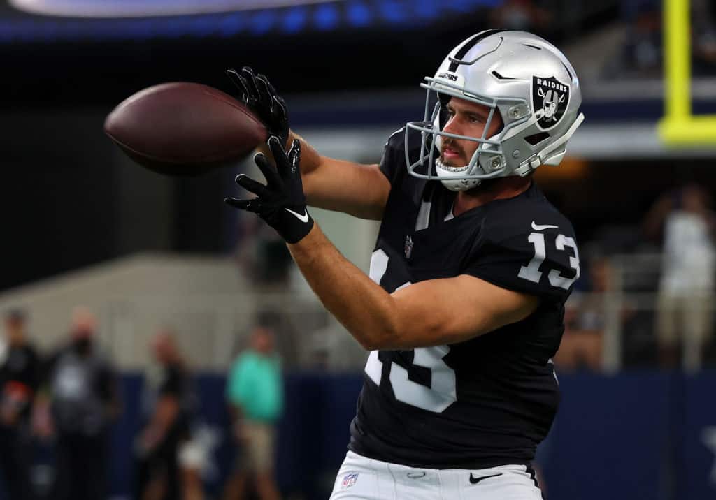 Hunter Renfrow #13 of the Las Vegas Raiders catches a pass in warm-ups before a preseason game against the Dallas Cowboys at AT&T Stadium on August 26, 2023 in Arlington, Texas.