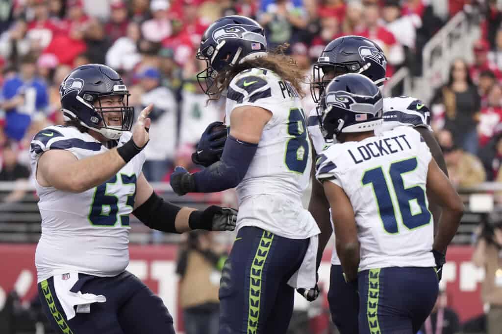 SANTA CLARA, CALIFORNIA - DECEMBER 10: Colby Parkinson #84 of the Seattle Seahawks celebrates after a touchdown with teammates during the third quarter in the game against the San Francisco 49ers at Levi's Stadium on December 10, 2023 in Santa Clara, California. 