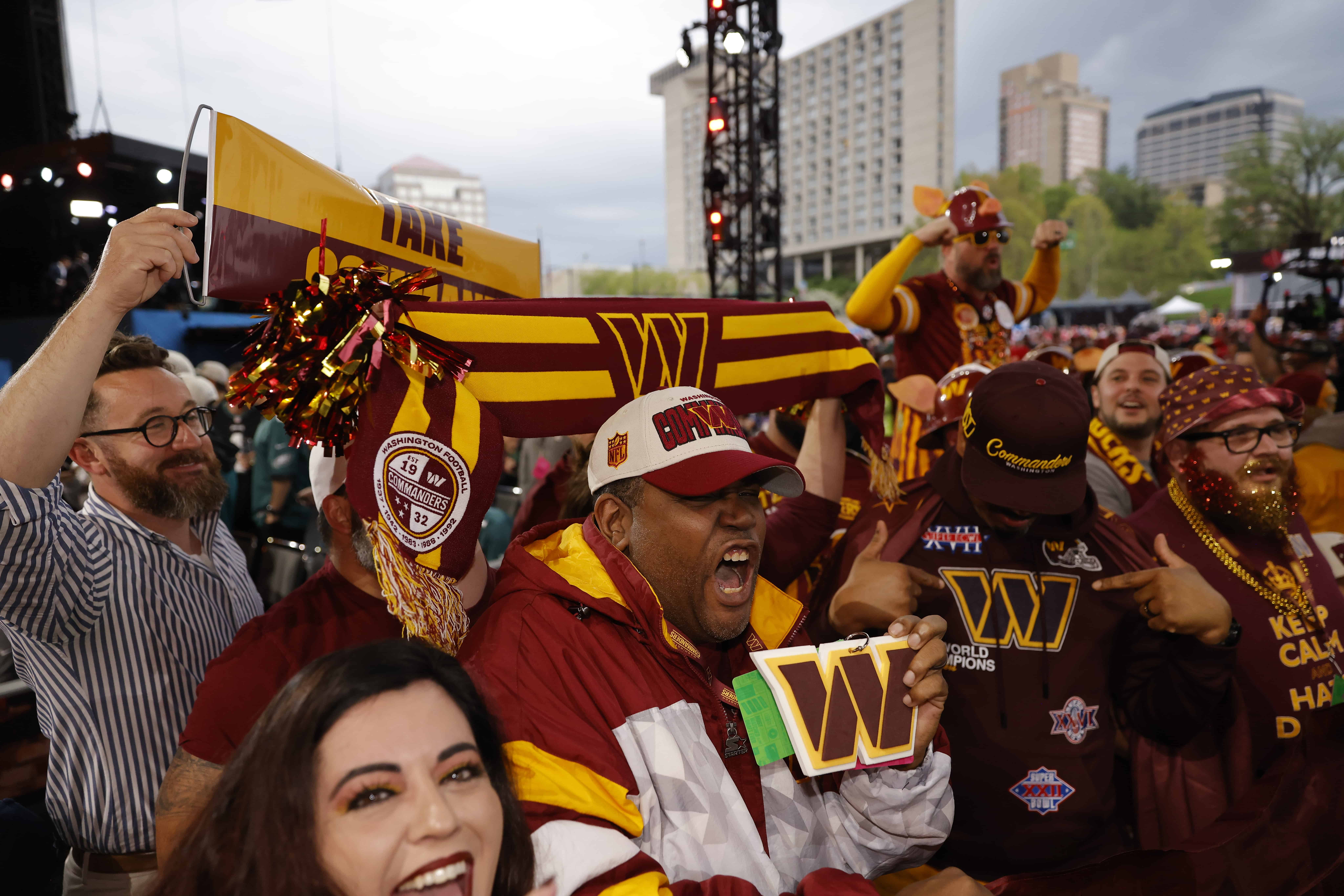 KANSAS CITY, MO - APRIL 28: Washington Commanders fans react to their teams selection in the second round of the 2023 NFL Draft at Union Station on April 28, 2023 in Kansas City, Missouri.