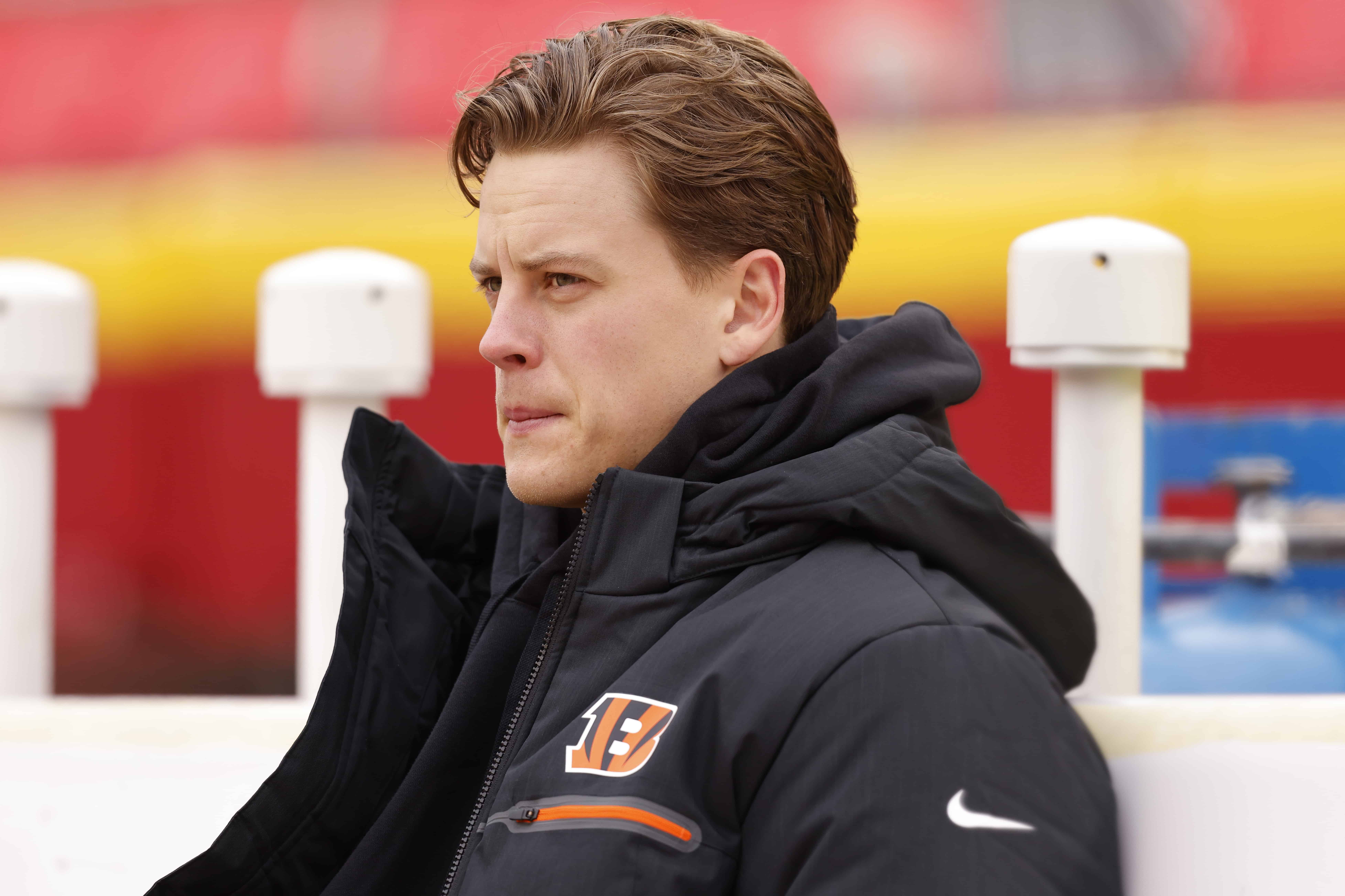 KANSAS CITY, MISSOURI - DECEMBER 31: Joe Burrow #9 of the Cincinnati Bengals sits on the bench before the game against the Kansas City Chiefs at GEHA Field at Arrowhead Stadium on December 31, 2023 in Kansas City, Missouri.